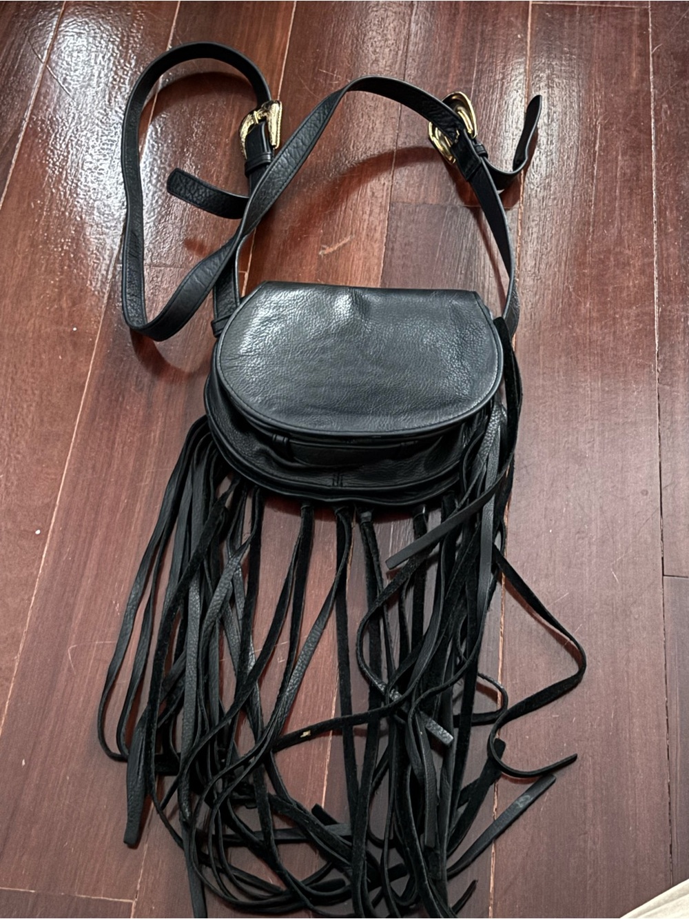 Black Fringe Crossbody Saddle Bag with Gold Hardware